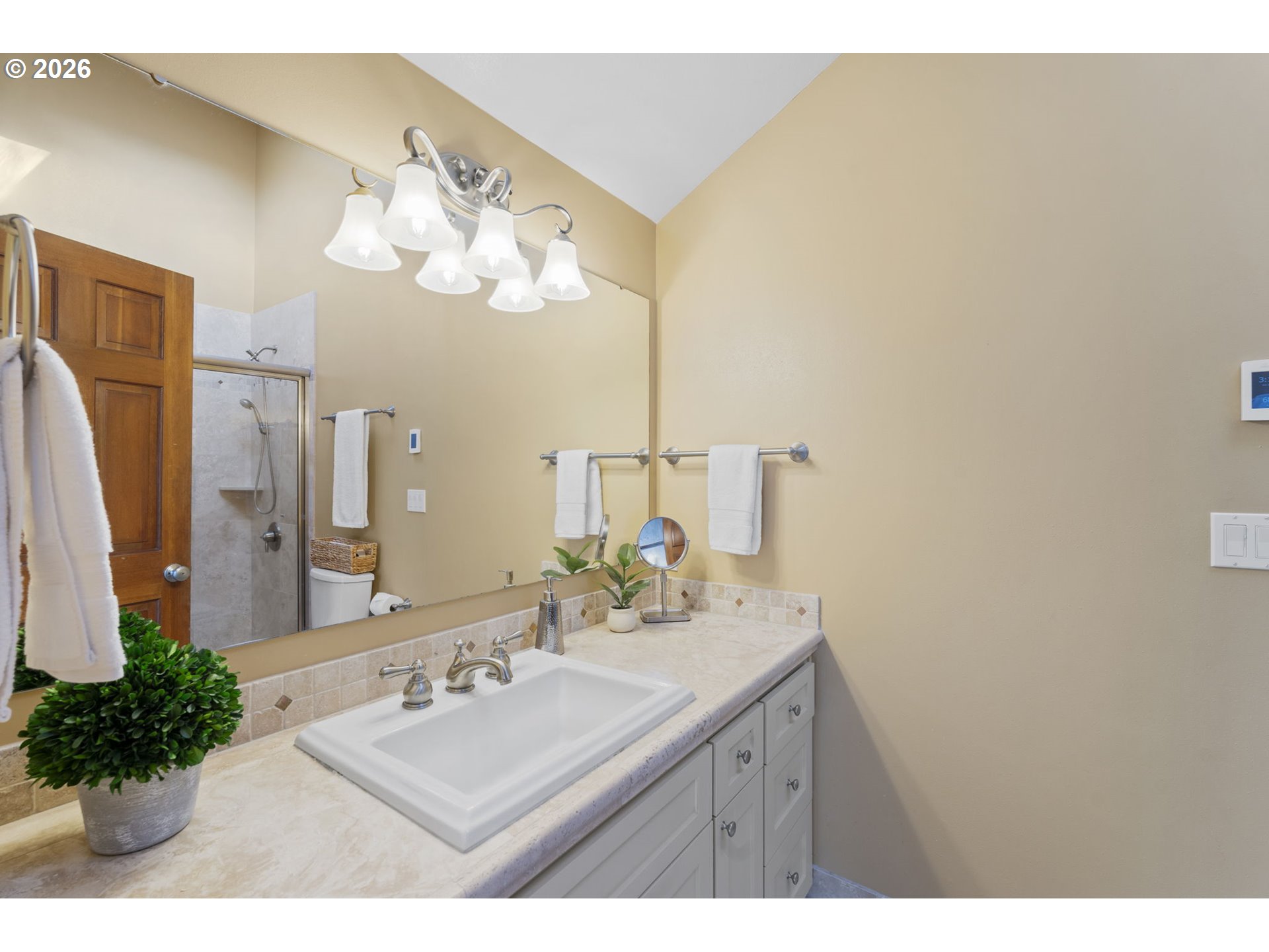 847 Fairway View Drive Eugene, OR 97401 - Photo 15 of 28 a bathroom with a sink vanity and a mirror
