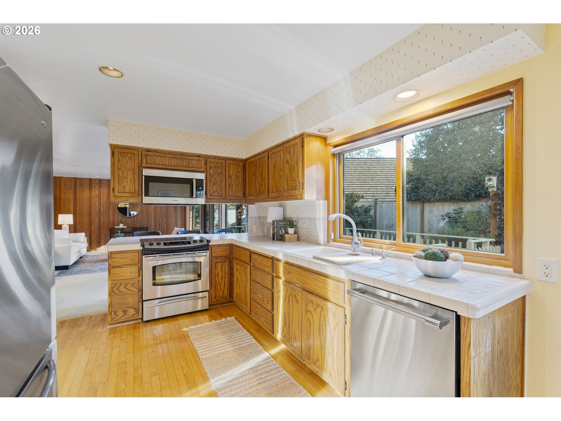 847 Fairway View Drive Eugene, OR 97401 - Photo 8 of 28 a kitchen with a stove a sink and a refrigerator