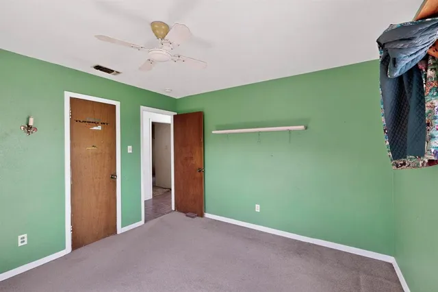 a view of a room with closet and windows