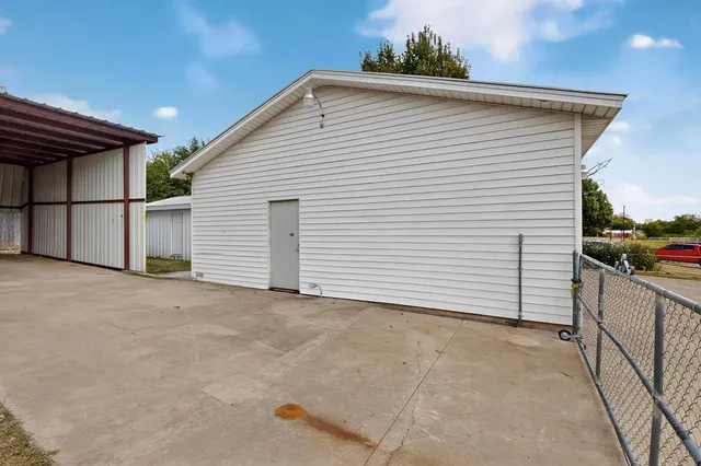 a view of a white house with a outdoor space