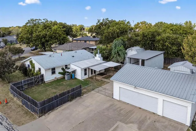 an aerial view of a house having yard