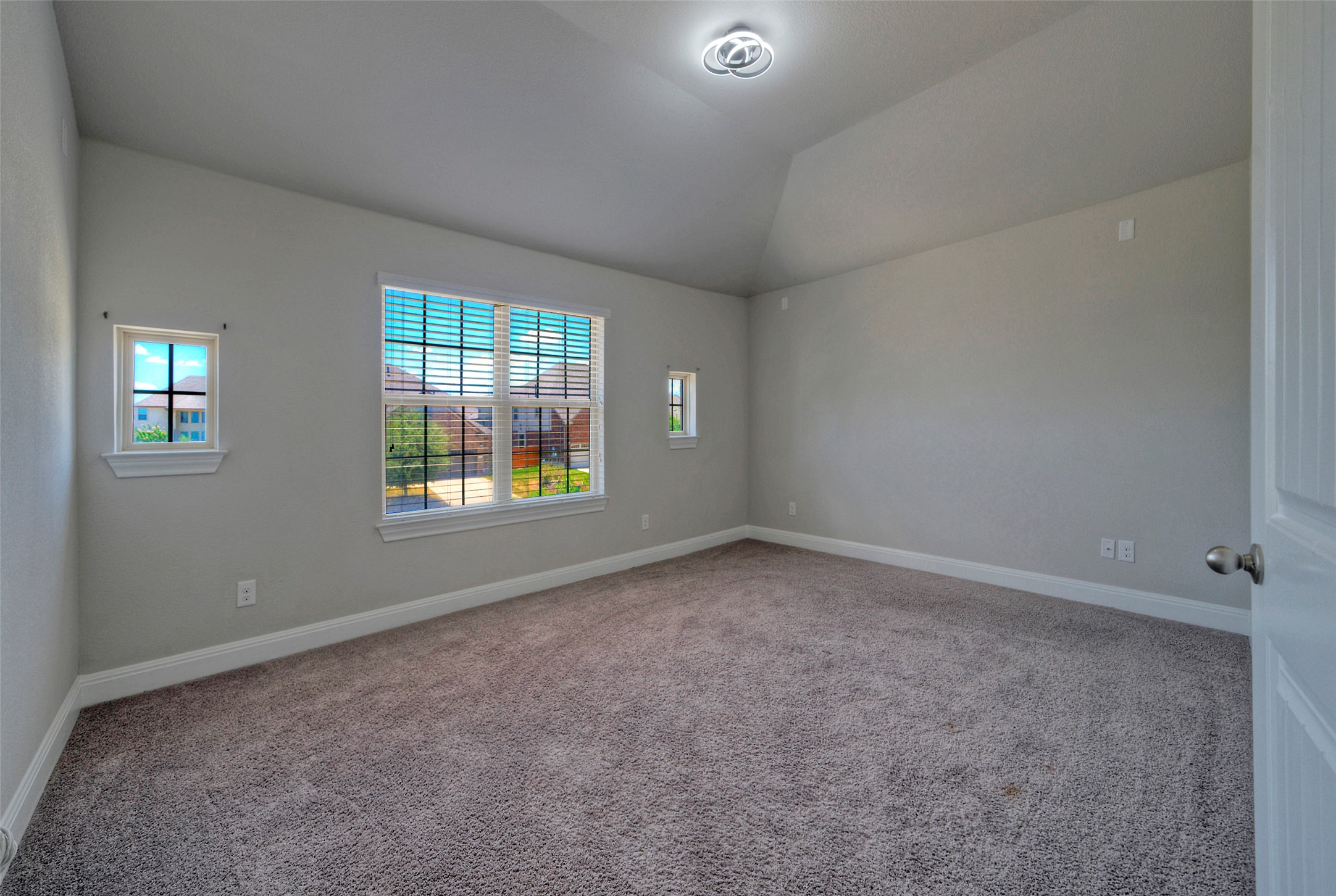 2260 Hat Bender Loop Round Rock, TX 78664 - Photo 22 of 40 A spacious theater room offers ample natural illumination, creating an inviting and airy atmosphere.