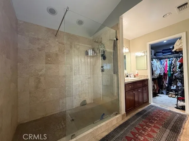 a bathroom with a shower and a sink