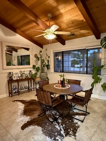 a view of a dinning table and chairs in the patio