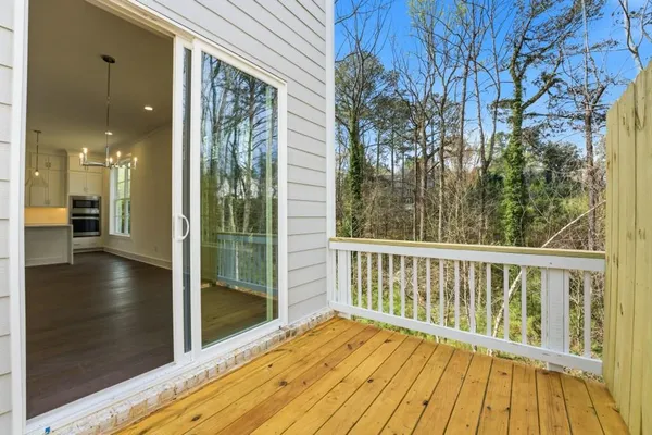 a view of a balcony with wooden floor