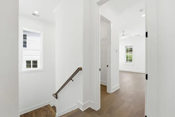 a view of a hallway with windows
