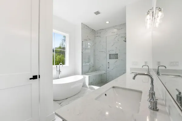 a bathroom with a bathtub and a sink