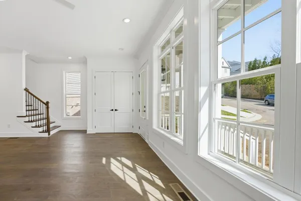 a view of an entryway with wooden floor