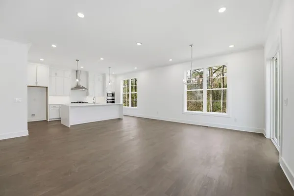 a view of kitchen with wooden floor and windows