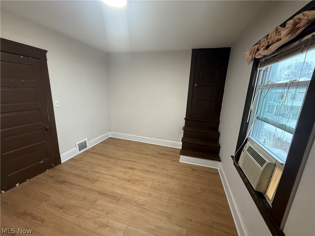 3612 Riverside Avenue Cleveland, OH 44109 - Photo 14 of 22 Interior room featuring wood-finish flooring, light-toned walls, and a ceiling-mounted light fixture