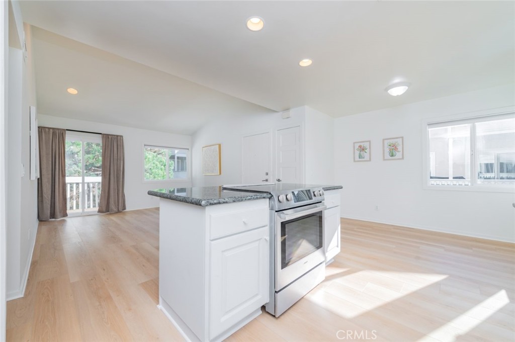 34028 Selva Road, Unit 77 Dana Point, CA 92629 - Photo 12 of 39 a kitchen with granite countertop a stove and a sink