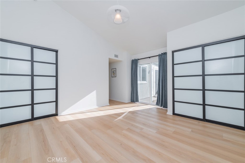 34028 Selva Road, Unit 77 Dana Point, CA 92629 - Photo 16 of 39 a view of a room with wooden floor and cabinet