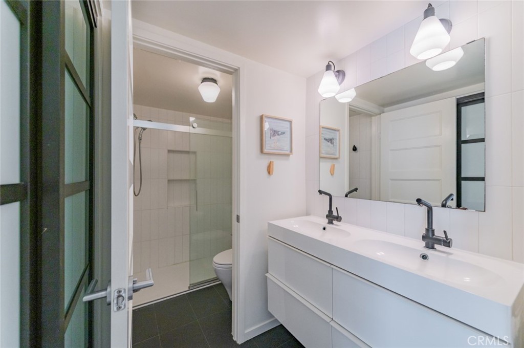 34028 Selva Road, Unit 77 Dana Point, CA 92629 - Photo 18 of 39 a bathroom with a sink a toilet and shower