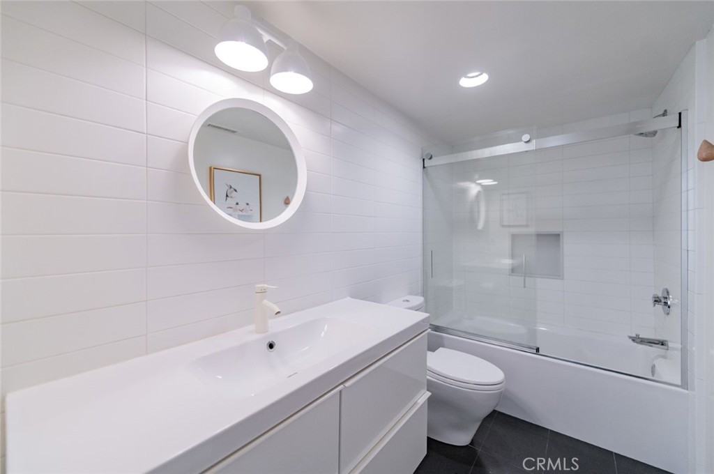 34028 Selva Road, Unit 77 Dana Point, CA 92629 - Photo 20 of 39 a bathroom with a sink a toilet and shower