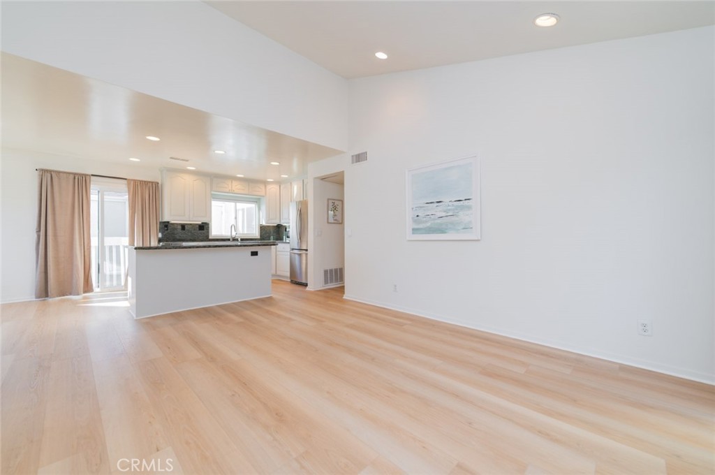 34028 Selva Road, Unit 77 Dana Point, CA 92629 - Photo 5 of 39 a view of a kitchen with a sink and a refrigerator