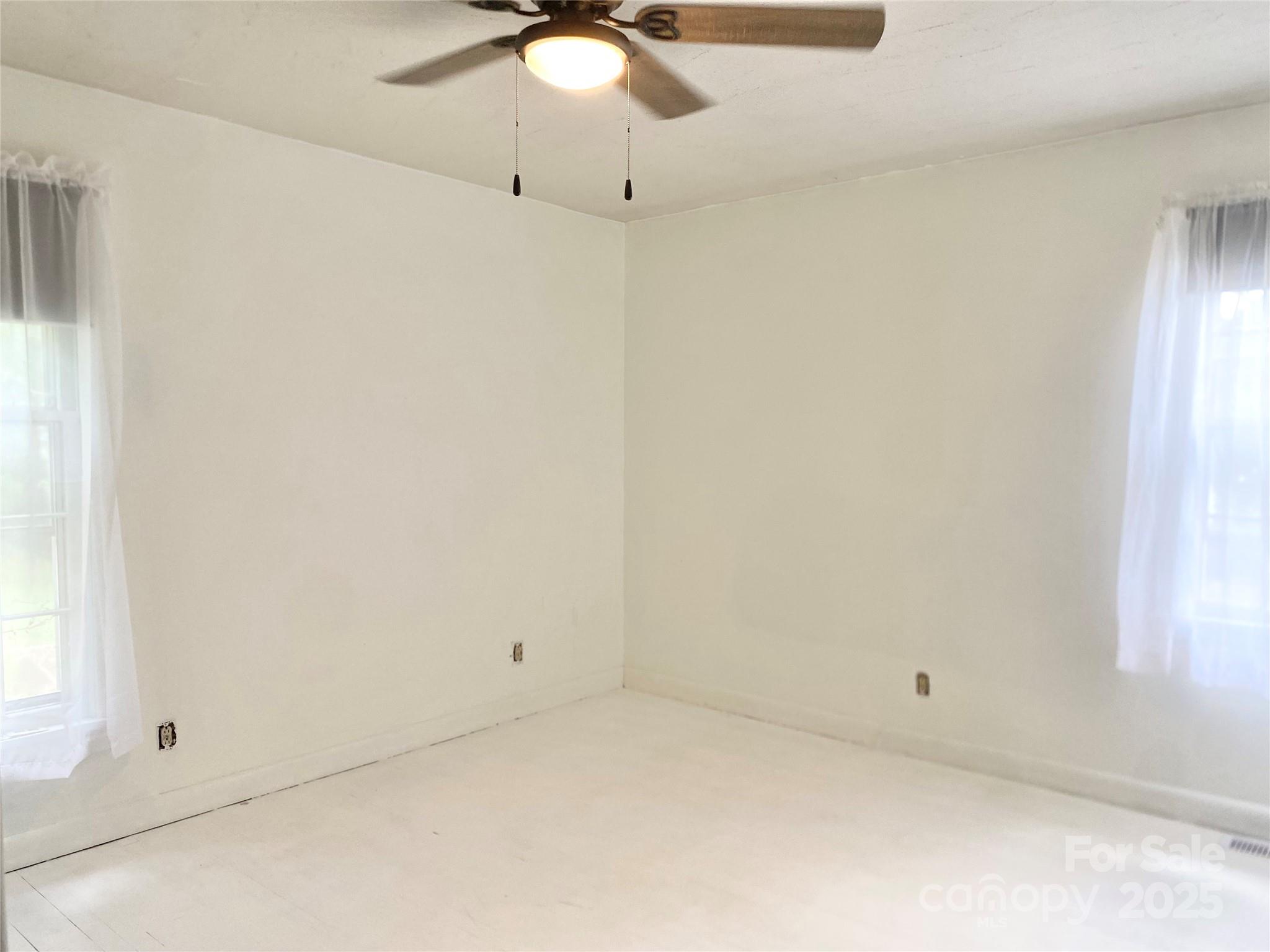 2855 Gheen Road Salisbury, NC 28147 - Photo 15 of 40 an empty room with a window and chandelier fan