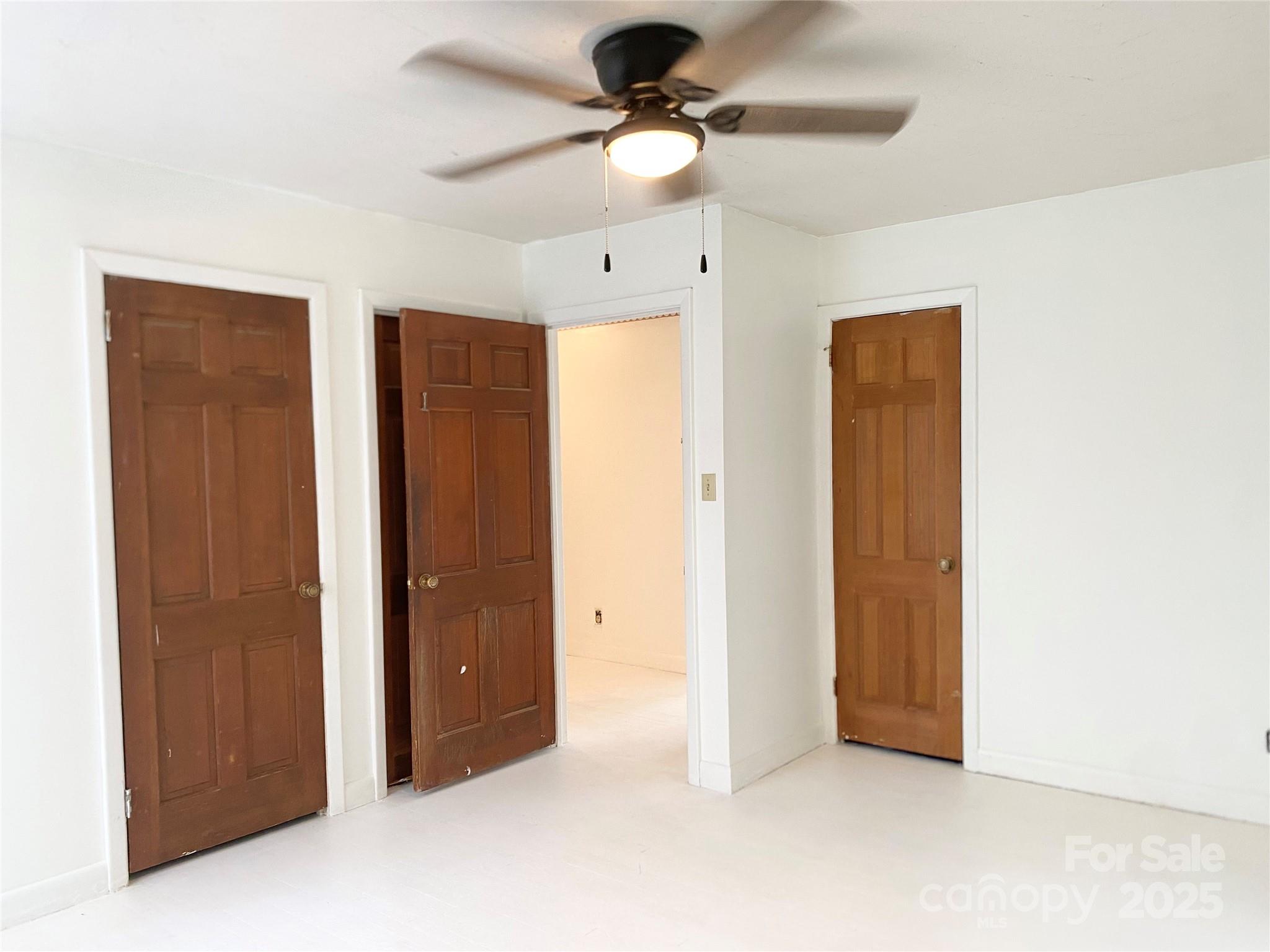 2855 Gheen Road Salisbury, NC 28147 - Photo 16 of 40 an empty room with closet and a chandelier fan