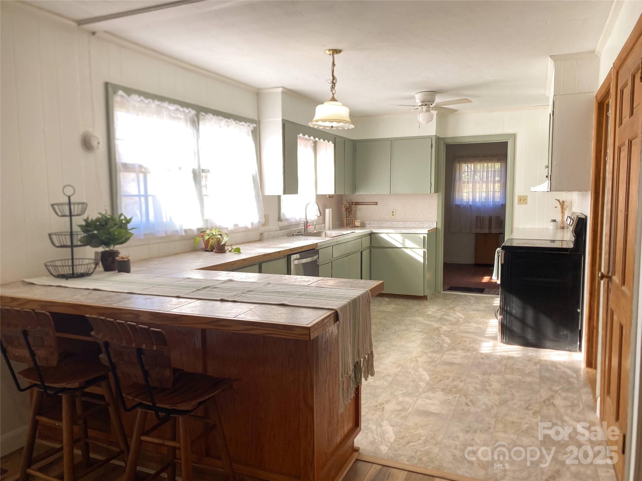 2855 Gheen Road Salisbury, NC 28147 - Photo 9 of 40 a kitchen with stainless steel appliances granite countertop a sink and a refrigerator