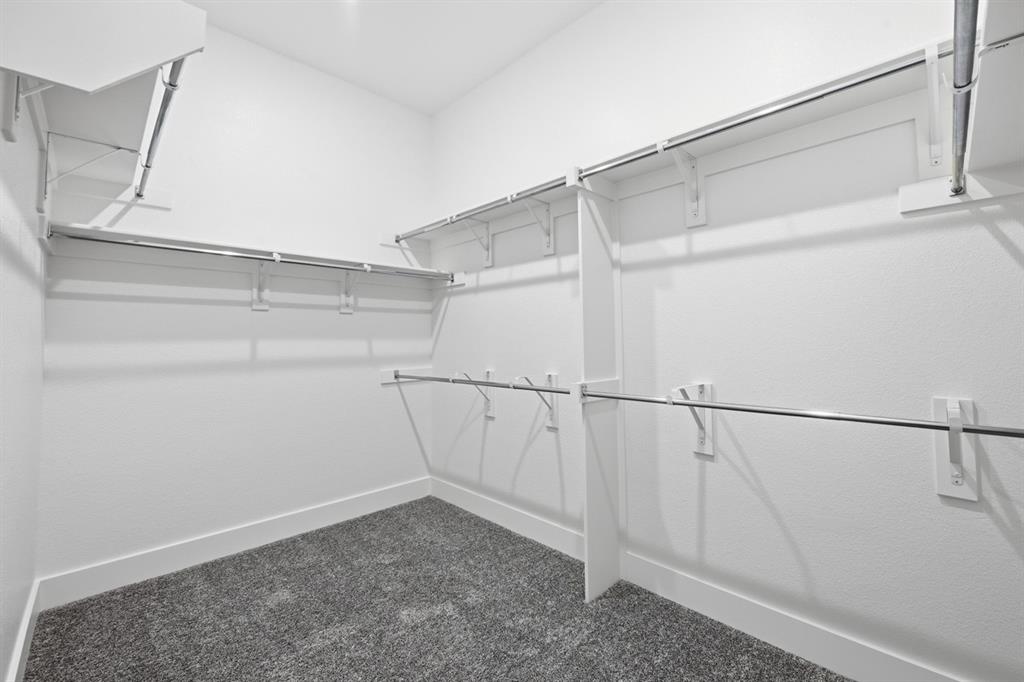 4107 Windy Point Court Oak Point, TX 75068 - Photo 15 of 30 a view of a room with racks on the wall