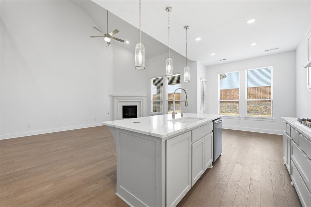4107 Windy Point Court Oak Point, TX 75068 - Photo 5 of 30 a kitchen with a sink and a stove top oven