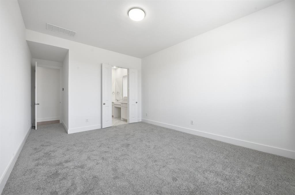 4107 Windy Point Court Oak Point, TX 75068 - Photo 10 of 30 an empty room with windows and closet