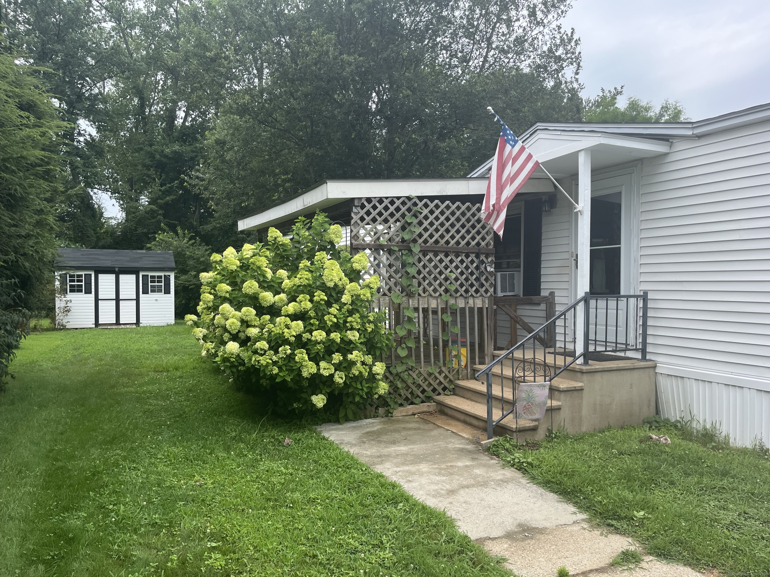 47 Elm Street East Windsor, CT 06088 - Photo 1 of 1 a front view of a house with garden