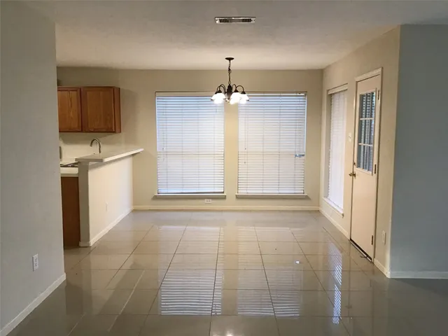 a view of a kitchen with a sink and a dishwasher cabinet