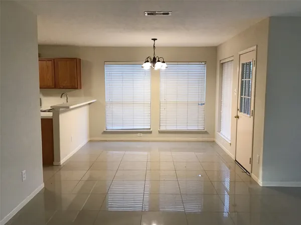 a view of a kitchen with a sink and a dishwasher cabinet