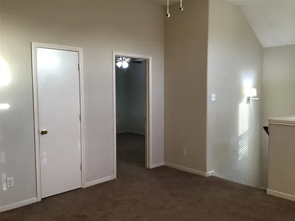 an empty room with closet area