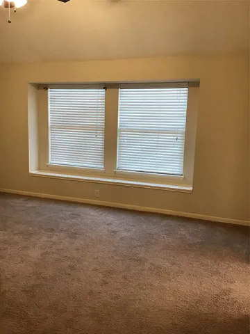 a view of a window in an empty room