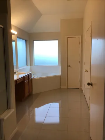 a view of a livingroom with a kitchen