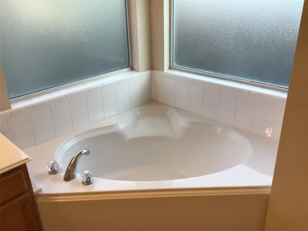 a close view of a bathtub in a bathroom