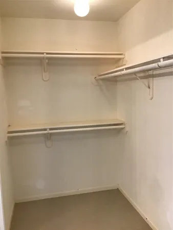 a view of an empty walk in closet