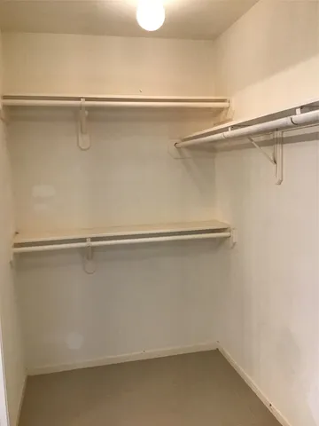 a view of an empty walk in closet