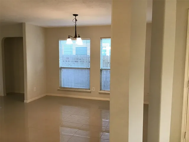 a view of a windows and chandelier in a room