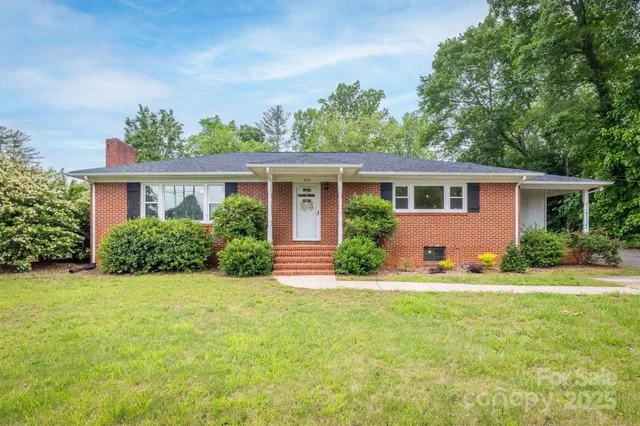 front view of a house that has a yard