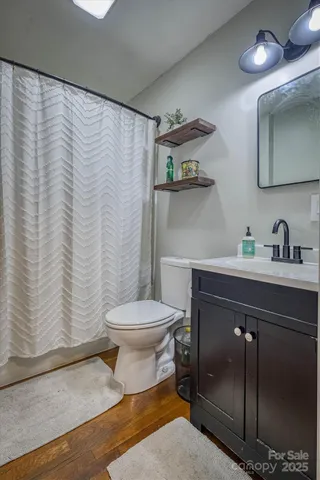 a bathroom with a toilet and a sink