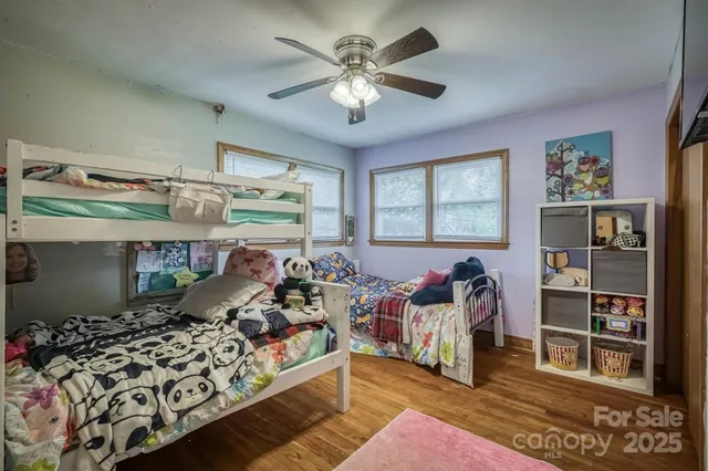 a bed room with a bed and a chandelier