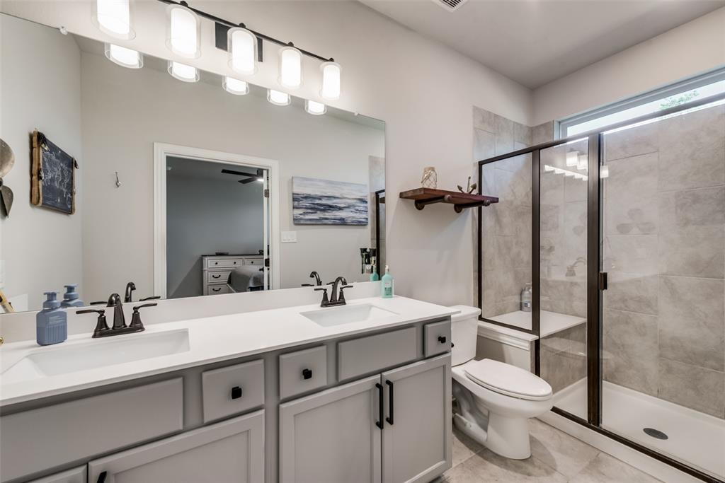 523 New Hope Street Terrell, TX 75160 - Photo 12 of 17 a bathroom with a sink a toilet and shower