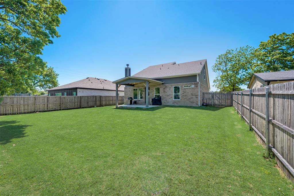 523 New Hope Street Terrell, TX 75160 - Photo 15 of 17 a front view of a house with garden