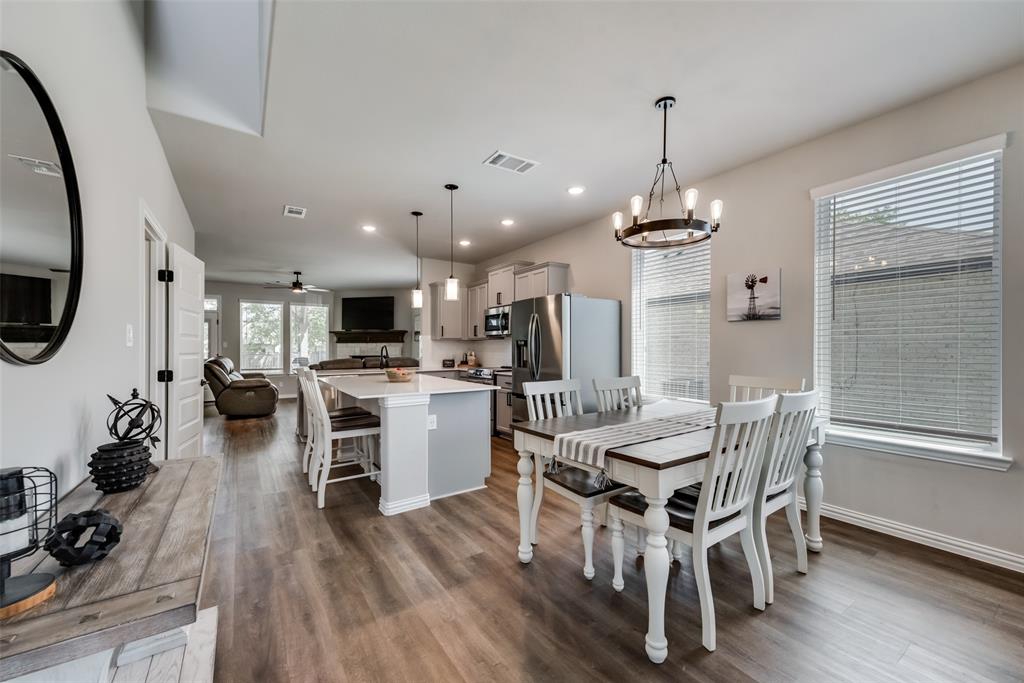 523 New Hope Street Terrell, TX 75160 - Photo 2 of 17 a view of a dining room with furniture wooden floor and a chandelier