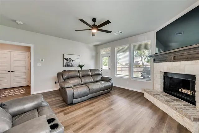 a kitchen with stainless steel appliances granite countertop a sink stove and microwave