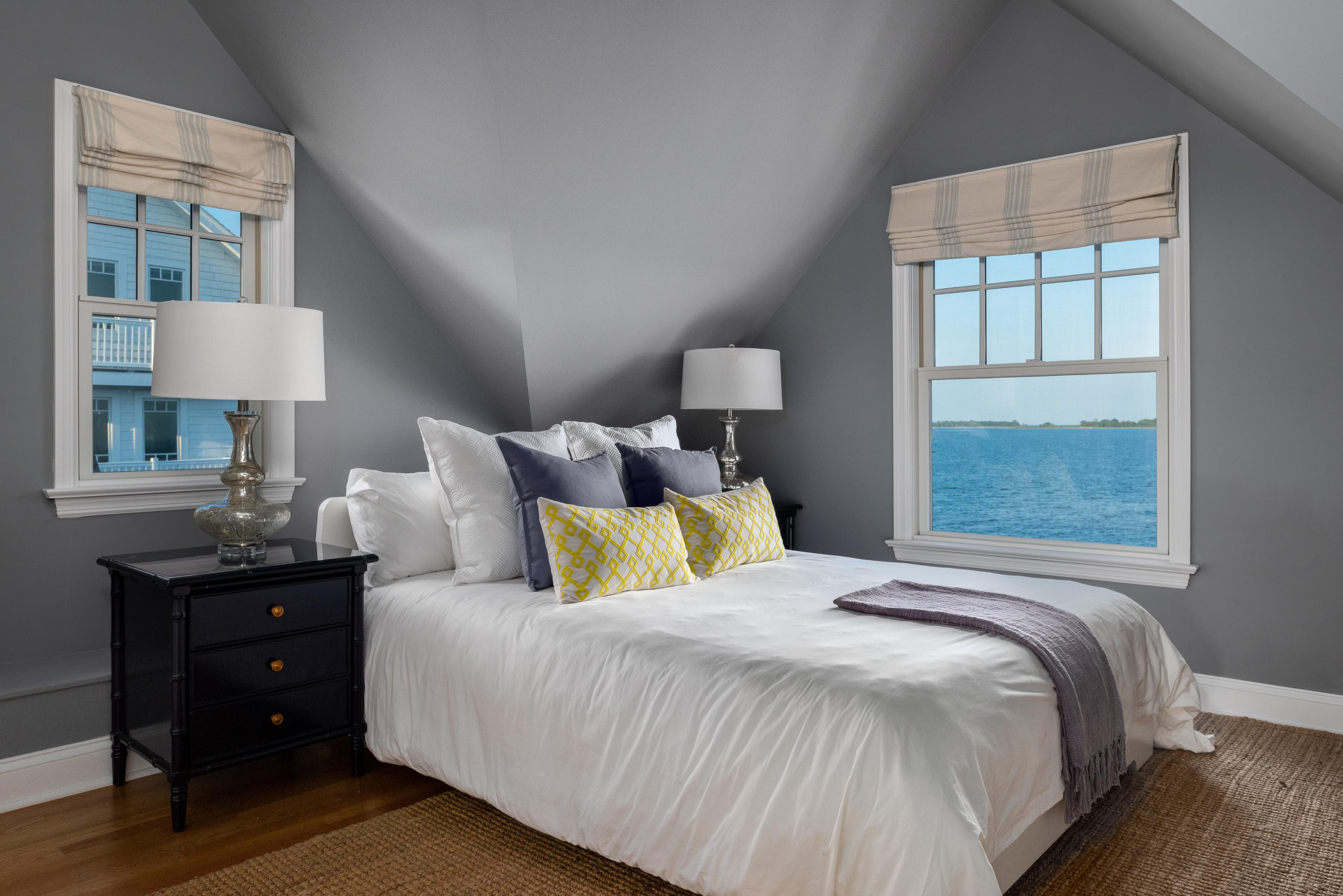 17 Rocky Point Road Rowayton, CT 06853 - Photo 19 of 25 a bedroom with a bed and a lamp on dresser