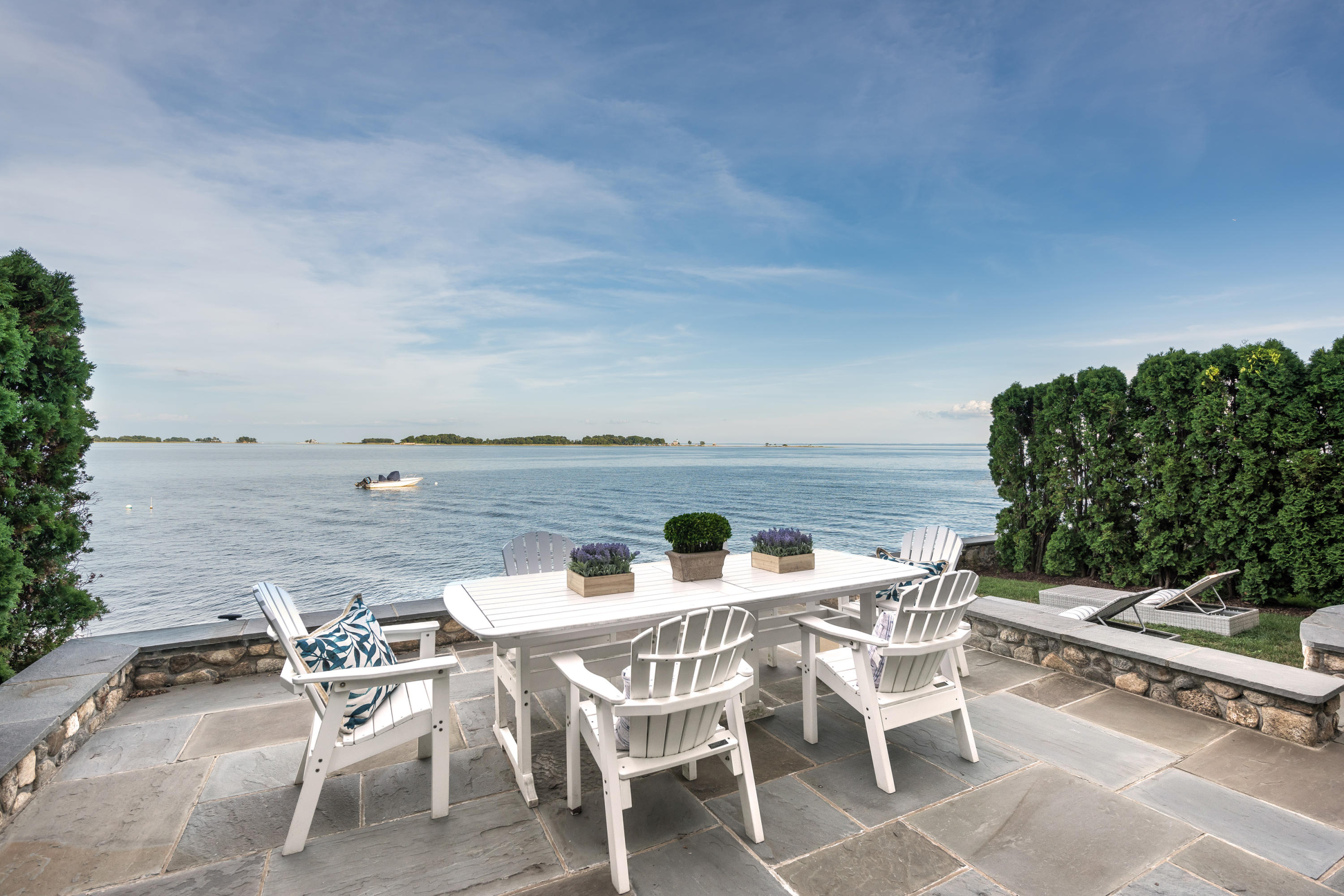 17 Rocky Point Road Rowayton, CT 06853 - Photo 5 of 25 a view of a terrace with furniture and stove