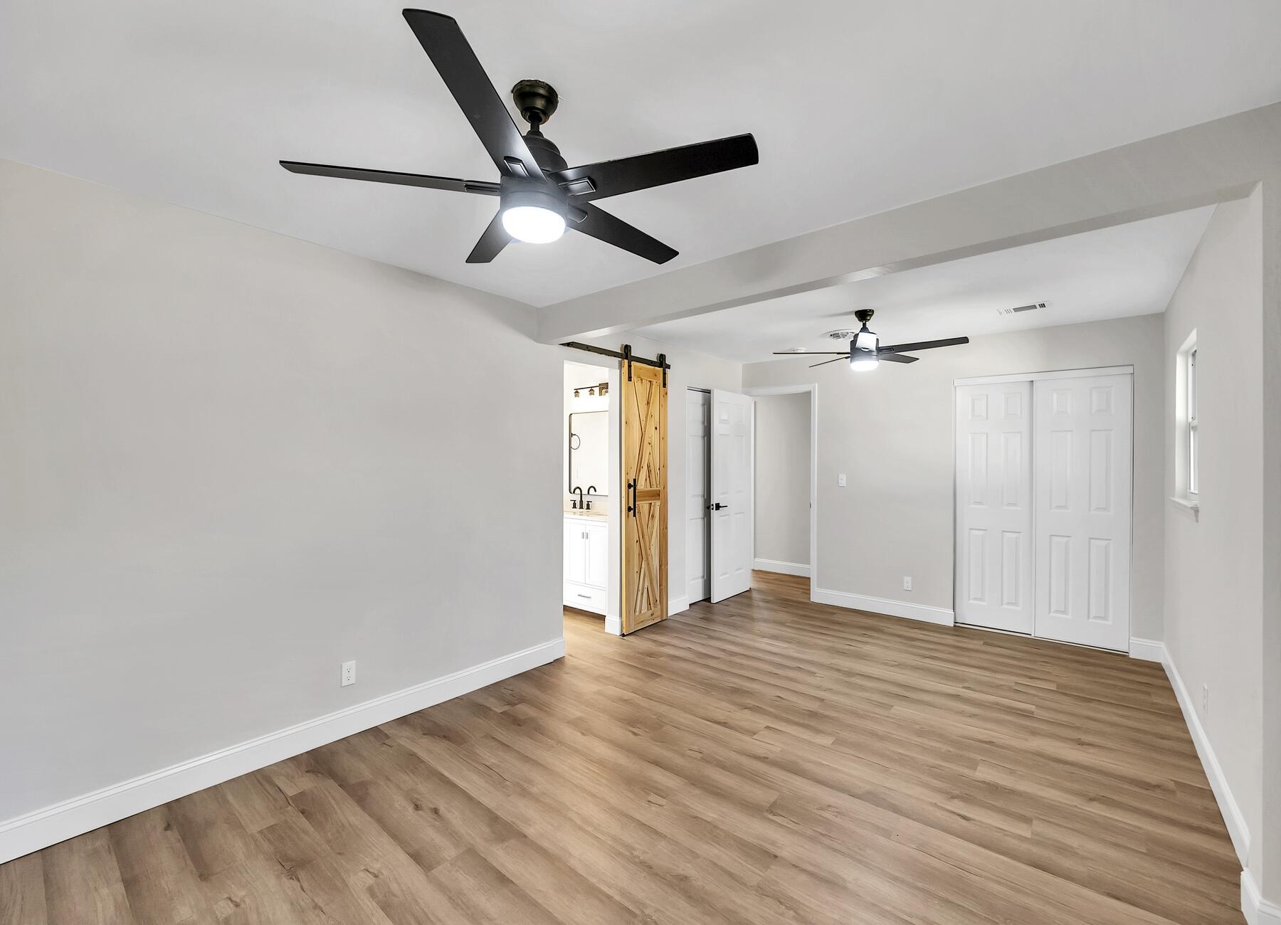 500 Ross Road Fort Walton Beach, FL 32547 - Photo 18 of 38 a view of empty room with wooden floor and fan