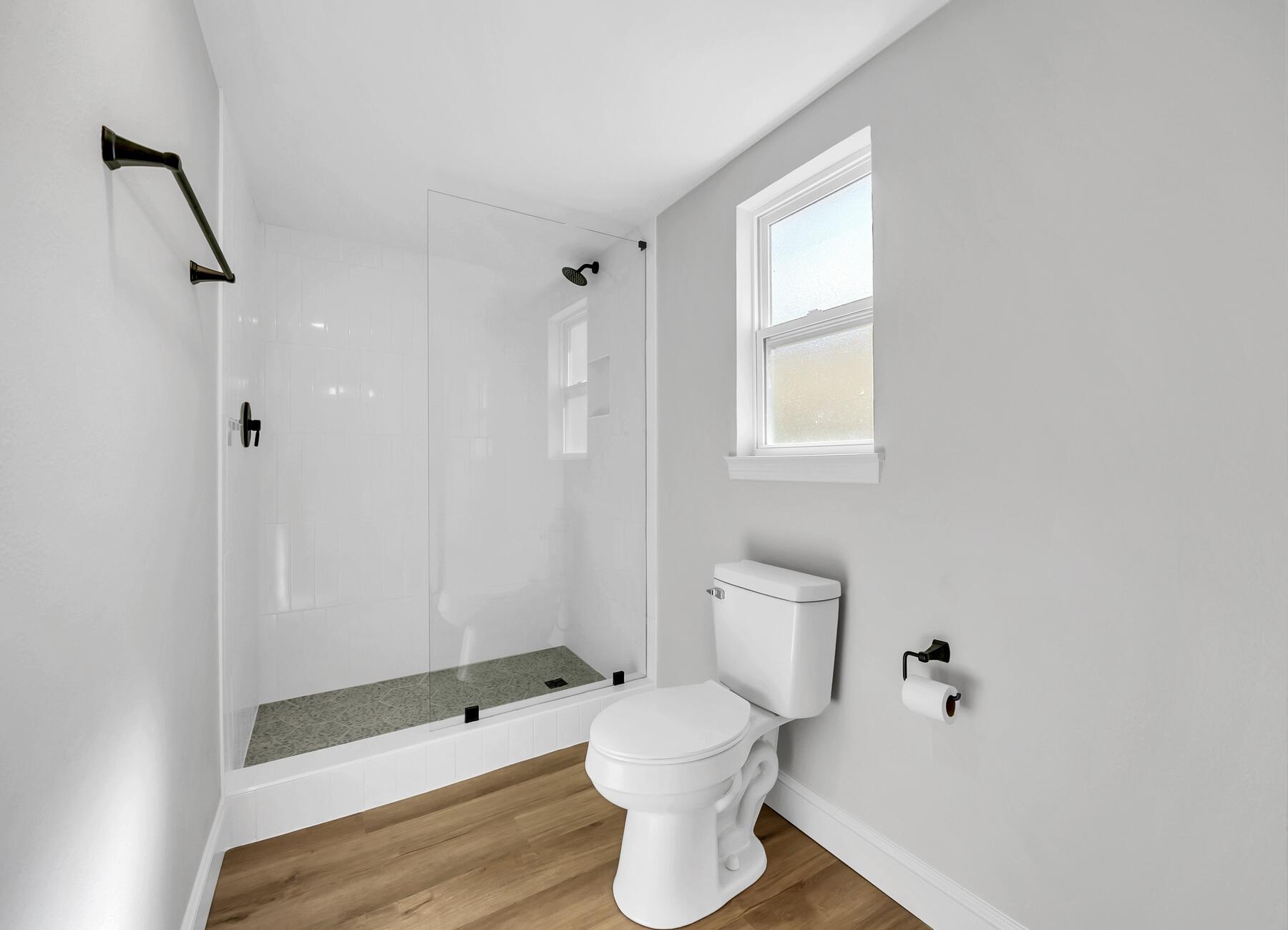 500 Ross Road Fort Walton Beach, FL 32547 - Photo 2 of 38 a bathroom with a toilet and a shower