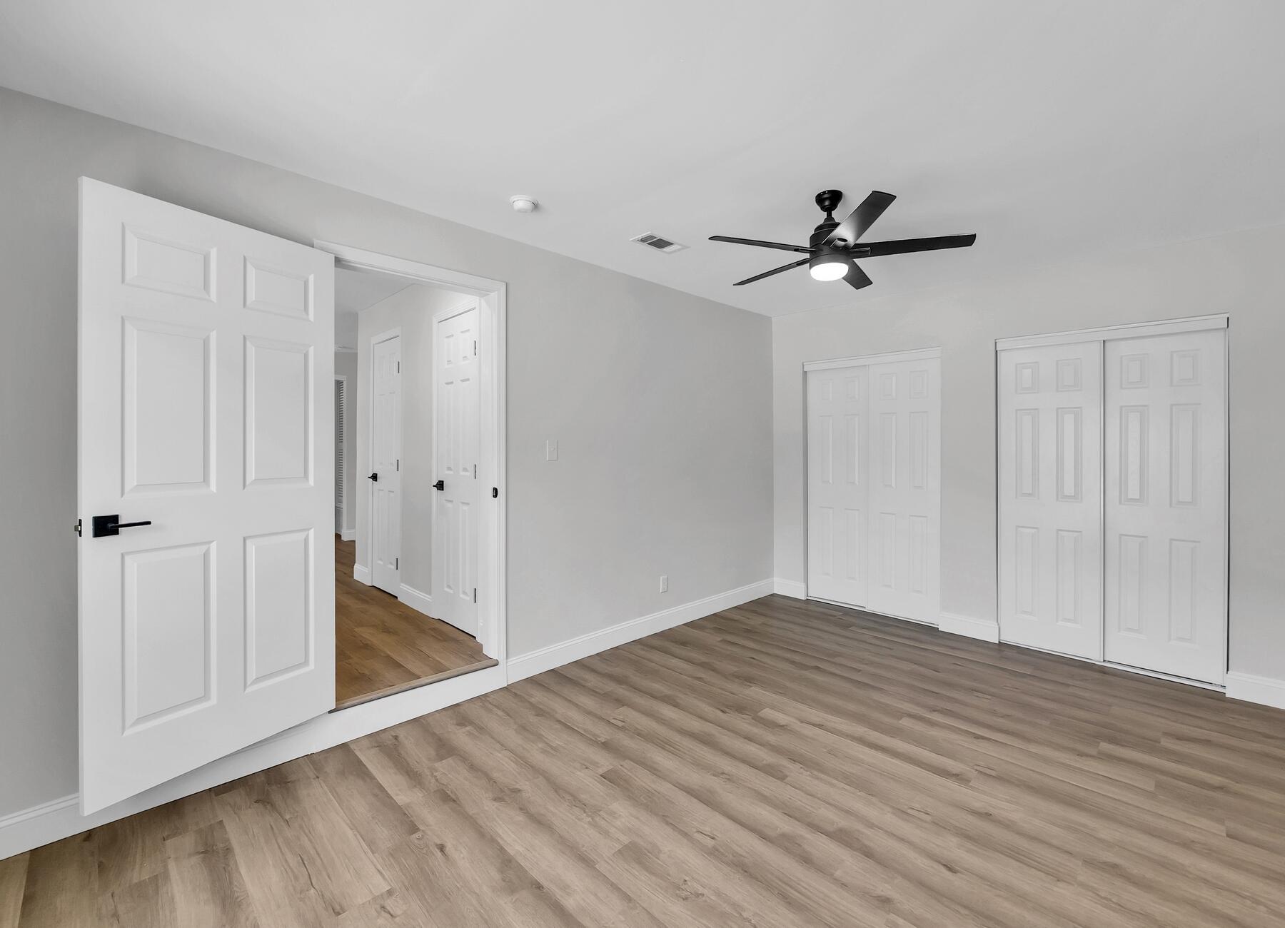 500 Ross Road Fort Walton Beach, FL 32547 - Photo 22 of 38 a view of empty room with wooden floor and ceiling fan