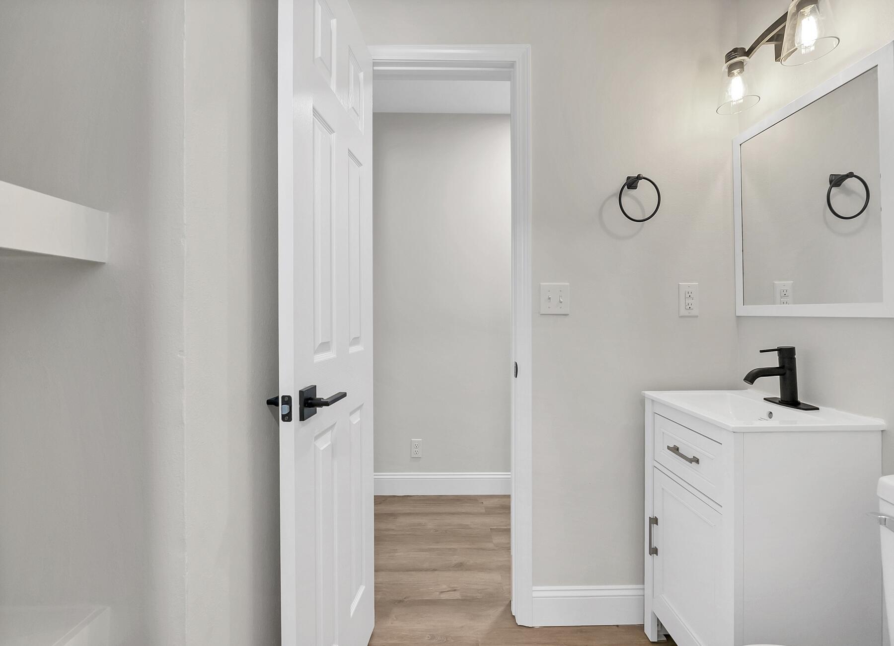 500 Ross Road Fort Walton Beach, FL 32547 - Photo 25 of 38 a bathroom with a sink a mirror and shower