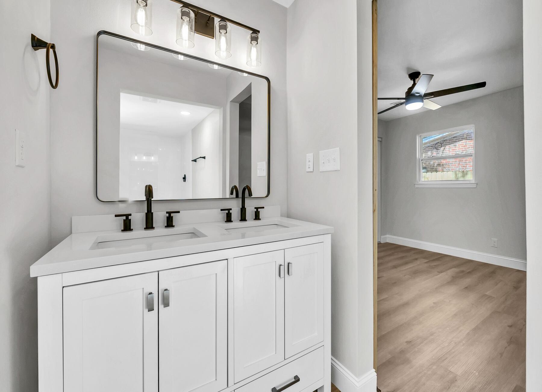 500 Ross Road Fort Walton Beach, FL 32547 - Photo 3 of 38 a bathroom with a sink vanity and a mirror