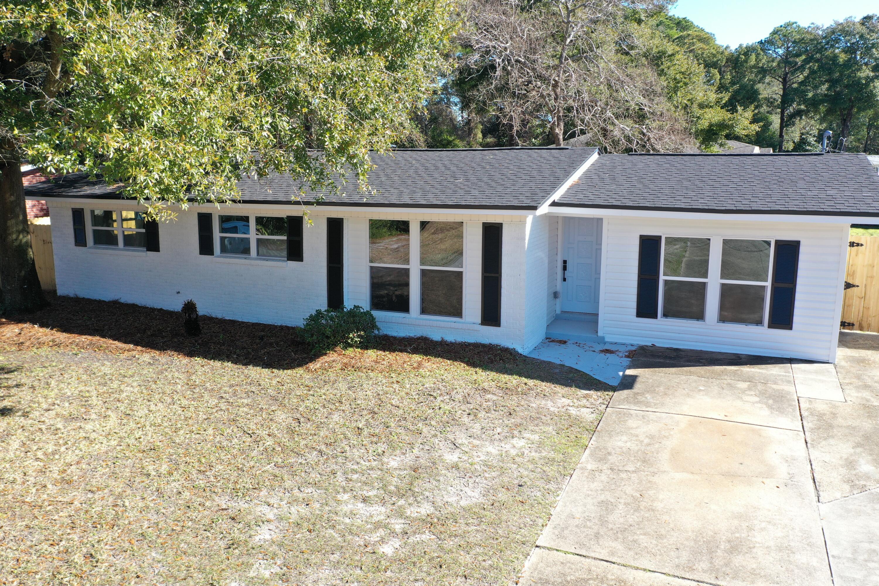 500 Ross Road Fort Walton Beach, FL 32547 - Photo 37 of 38 a house with trees in the background